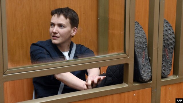 Ukrainian military pilot Nadia Savchenko sits inside a defendant's cage during her sentencing hearing at a court in the southern Russian town of Donetsk on March 22.