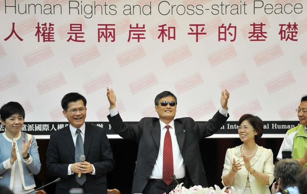 Chinese activist Chen Guangcheng gestures during his appearance at Taiwan's parliament in Taipei, June 25, 2013.