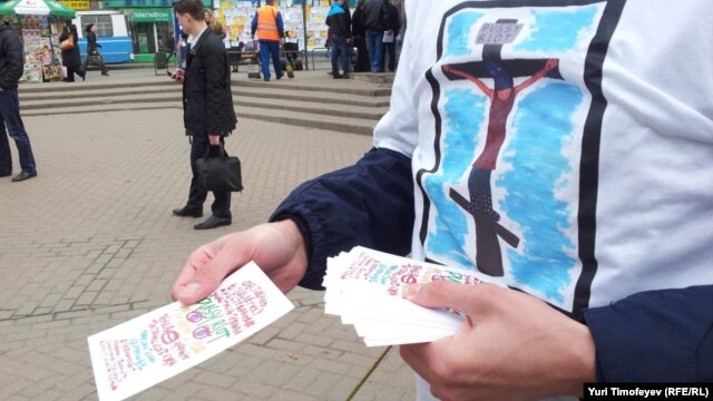 An activist hands out leaflets during an action in Moscow in support of Pussy Riot in 2012.