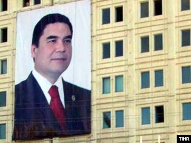 A huge portrait of Turkmen President Gurbanguly Berdymukhammedov on the side of a building in Dashoguz