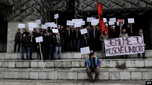 Ethnic Albanians take part in a protest in Pristina on January 16