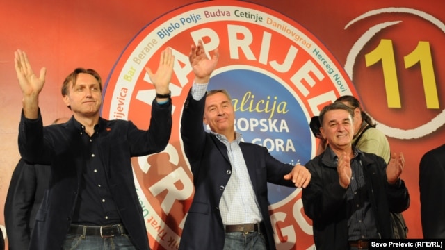 Veteran Montenegrin leader Milo Djukanovic (center) celebrates the win by his Coalition for European Montenegro.