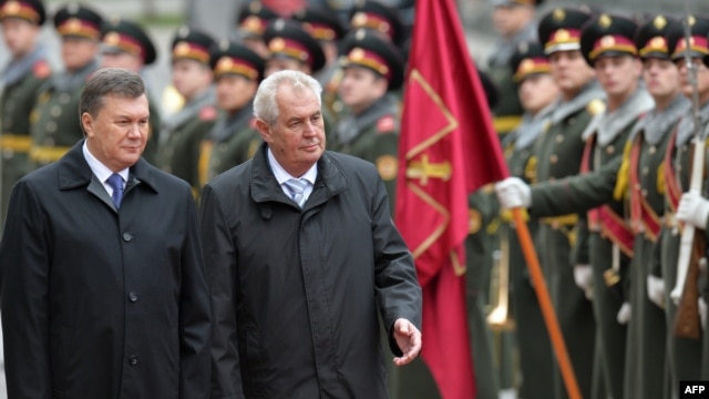 Ukrainian President Viktor Yanukovych (left) and Czech counterpart Milos Zeman walk in front of the guard of honor during a ceremony in Kyiv in October.