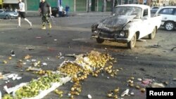 One of the attacks was a suicide bombing at a crowded market in the town of Sweida.