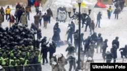 Police clash with supporters of former Georgian President Mikheil Saakashvili in a tent camp in front of the Ukrainian parliament in Kyiv on February 27.