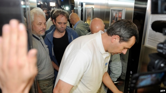 The first team of OSCE observers arrive at a hotel in Donetsk after being freed on June 27.