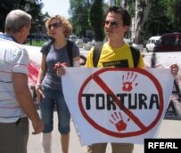 Rights activists march against police brutality in Moldova.