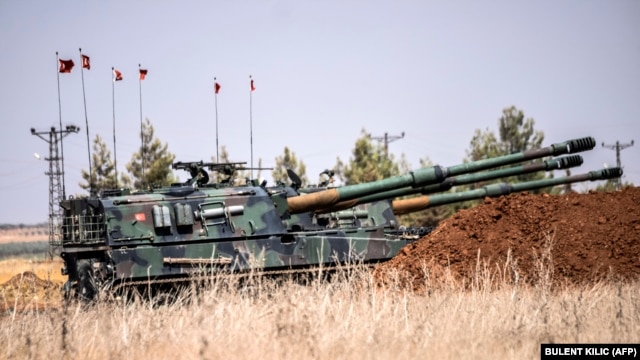Turkish military tanks are seen during clashes between Turkish soldiers and Islamic State fighters 20 kilometer west of the Turkish-Syrian border town of Karkamis, in the southern region of Gaziantep, on September 3.