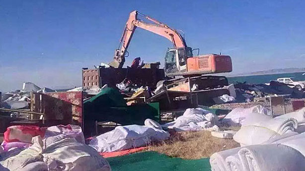 Chinese work crews tear down Tibetan shops and homes at Qinghai Lake, June 2016.