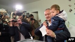 The presidential candidate of the Socialist Party of Moldova, Igor Dodon, votes at a polling station in Chisinau on October 30.