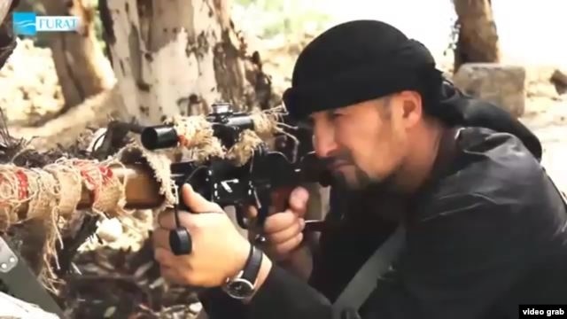 Former Tajik police commander Gulmuro Halimov appeared in a video posted online that showed him brandishing a sniper rifle and threatening to bring holy war to Russia and the United States.