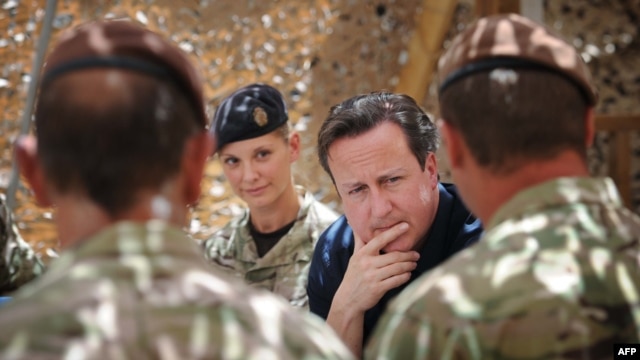 British Prime Minister David Cameron meets British soldiers based in Helmand Province earlier this year. 