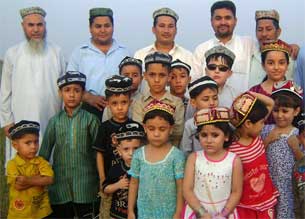 Members of the Omer Uyghur Foundation and language school pose for a photo in Rawalpindi, Pakistan in February 2010.