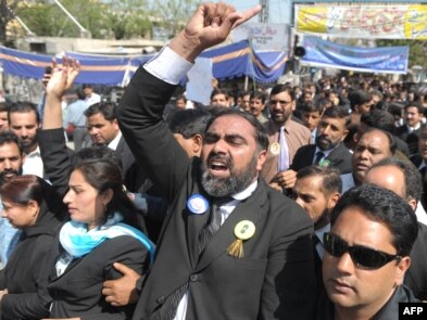 Pakistani lawyers march during a protest in Rawalpindi on March 13.