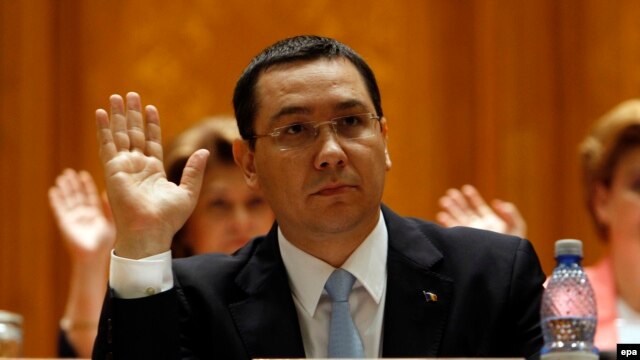 Romanian Prime Minister Victor Ponta votes at the opening of a no-confidence motion in front of the parliament in Bucharest on June 12.