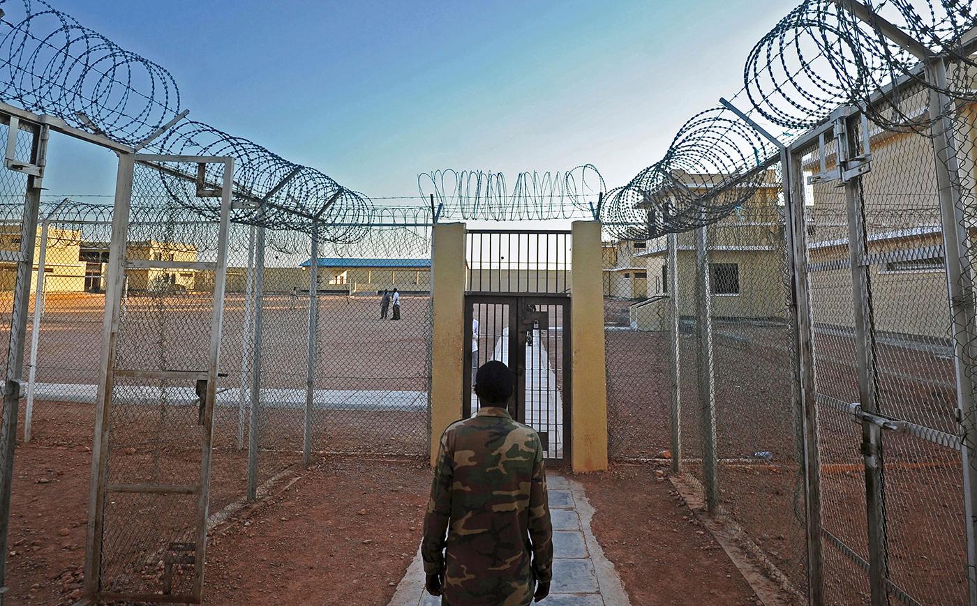A prison warden at a prison in Garowe, Puntland state, in northeastern Somalia, December 2016. Fifty-four boys, some as young as 12, sent to fight by Al-Shabab in Puntland, spent months in this facility far from their homes. A military court sentenced 28 of the 54 boys to long prison terms, which they are now serving in a rehabilitation center in Garowe.