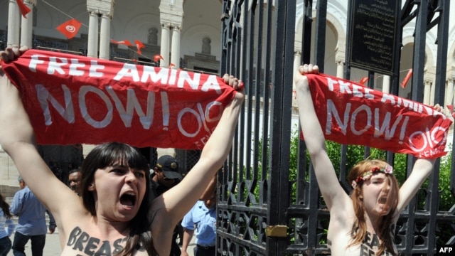 Activists from the women's movement Femen demonstrate in Tunis on May 29. They shouted 'Free Amina,' in reference to the young Tunisian woman imprisoned for protesting against hard-line Islamists and awaiting trial for illegally possessing pepper spray.