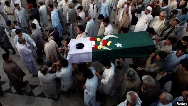 People attend the funeral in Quetta for Pakistani Major Jawad Changezi, who was killed during cross-border fighting with Afghanistan.