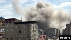 Smoke rises a building after the explosion in Diyarbakir.