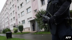 Policen officers secure a residential area in the town of Chemnitz in eastern Germany.
