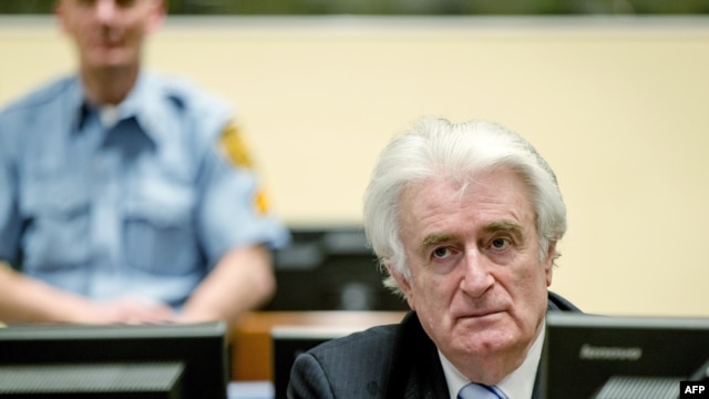 Bosnian Serb wartime leader Radovan Karadzic sits in the courtroom for the reading of his verdict at The Hague on March 24, 2016.