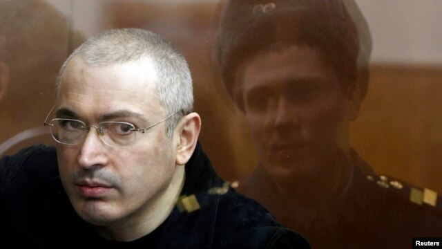 Jailed former oil tycoon Mikhail Khodorkovsky stands in the dock during a court session in Moscow in April 2010.