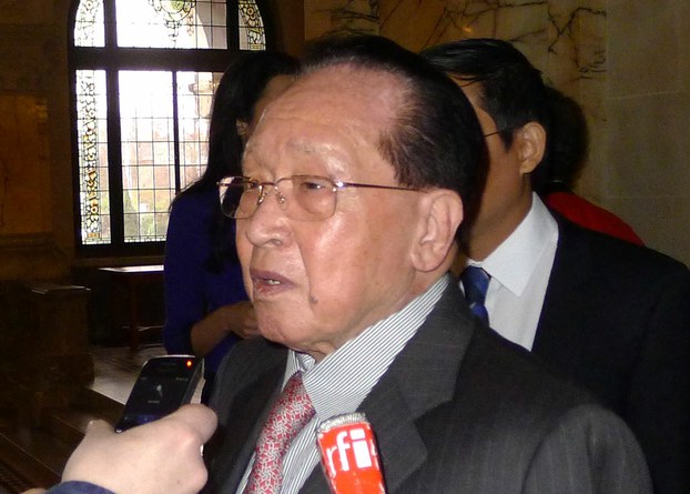 Hor Namhong speaks to reporters on the sidelines of the International Court of Justice in The Hague, April 15, 2013.