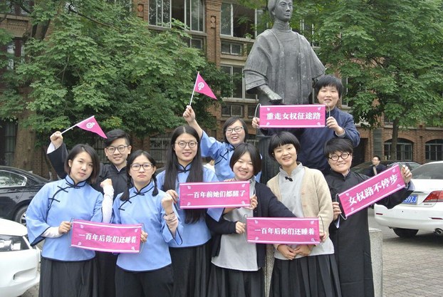 Ten activists don historical costumes to mark a historic feminist march for International Women's Day in Guangzhou, southern China's Guangdong province, March 6, 2017.