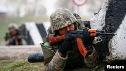 Kazakh soldiers take part in training for peacekeeping missions outside Almaty.