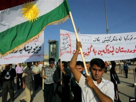 Kurds wave their flag during a demonstration against Turkey in Kirkuk.