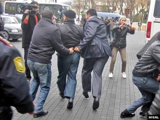 A Musavat Party member is arrested for protesting outside the Baku city hall.