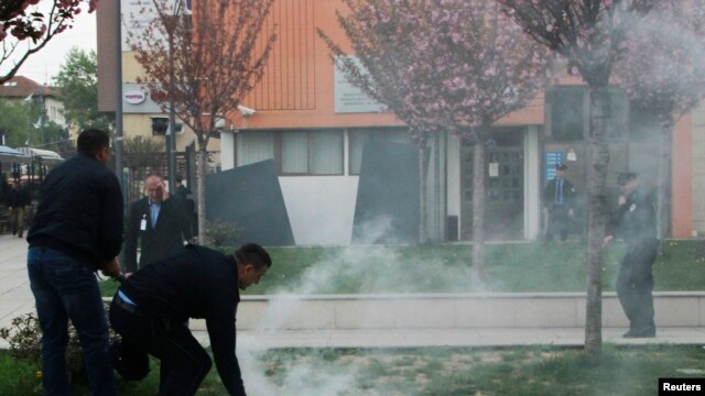 Kosovo – Protesters firing tear gas disrupt the inauguration ceremony for new President Hashim Thaci in Pristina, April 8, 2016