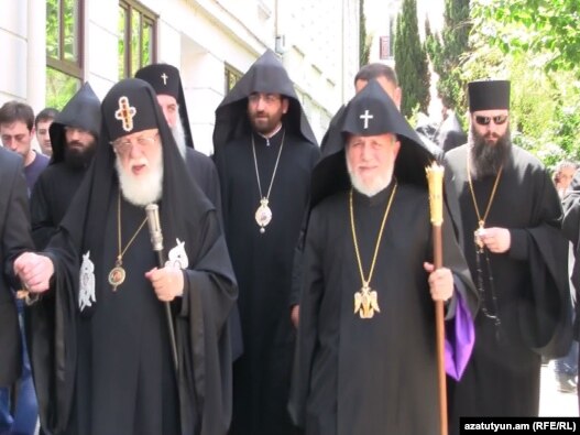 Catholicos Garegin II (left) and Catholicos Patriarch Ilia II meet in Tbilisi on June 11.