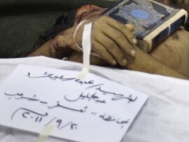 The Koran is placed on the body of an antigovernment protester, Abdou Saeed Mohammed, who was killed during recent with security forces in Sanaa.