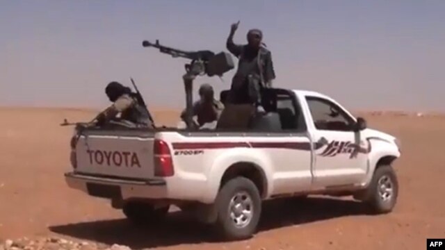 An image grab from a video uploaded on YouTube allegedly shows a Jihadist group in Anbar province (file photo)