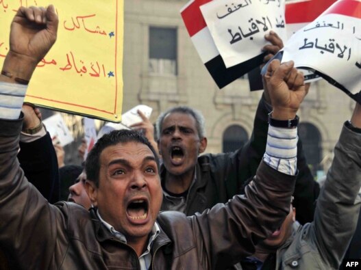 With tensions mounting, Egyptian Muslims and Christians protested in Cairo on January 9 to condemn the recent deadly violence against Coptic Christians.