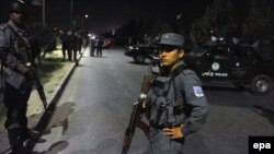 Afghan security officials secure the road leading to the American University of Afghanistan after a Taliban attack on the university in Kabul in August.