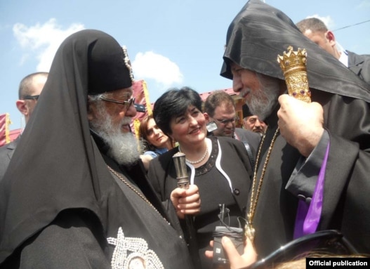 Catholicos-Patriarch Ilia II (left) greets Armenia's visiting Catholicos Garegin II on June 10.