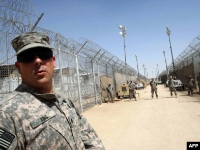 U.S. soldiers guard Camp Bucca on the outskirts of Basra.