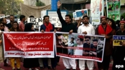 People hold a rally in support of Mashal Khan, who was killed by a mob of fellow students for alleged blasphemy at Abdul Wali Khan University.