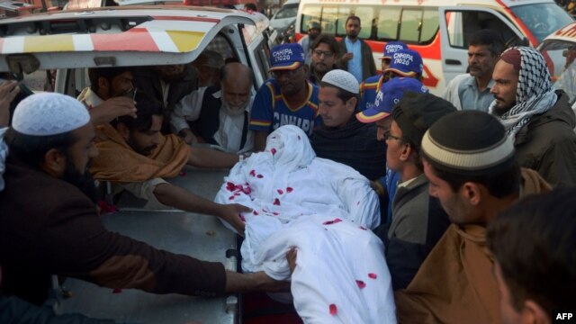Relatives and volunteers move the body of a convicted militant from the banned Sunni militant group Lashkar-e-Jhangvi (LeJ) from the central jail in Karachi to an ambulance after he was executed in early February, more than a month after Pakistan's unofficial moratorium on capital punishment was lifted.