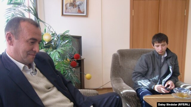 Avaz Saipov (left), slain journalist Alisher Saipov's father, with Ozodbek, one of three sons to have been attacked in the recent incident, in a November 2010 photo.