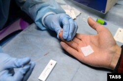 A patient is examined at a mobile HIV testing unit in Yekaterinburg in 2016.