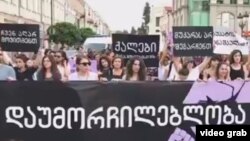 Women rights defenders march against violence in Tbilisi on July 19.
