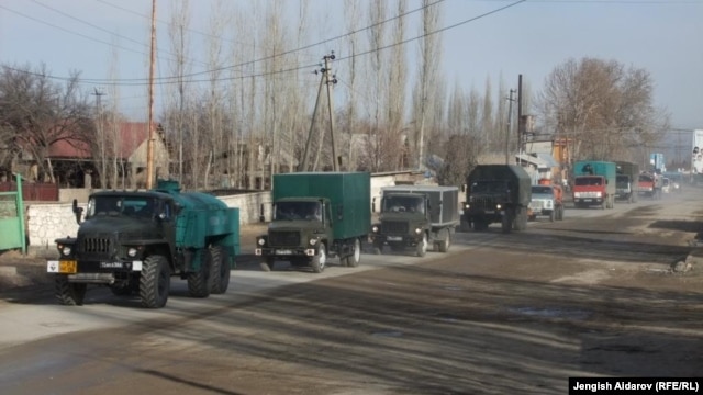 A group of trucks with relief supplies from Uzbekistan to the Sokh exclave arrive at a checkpoint.