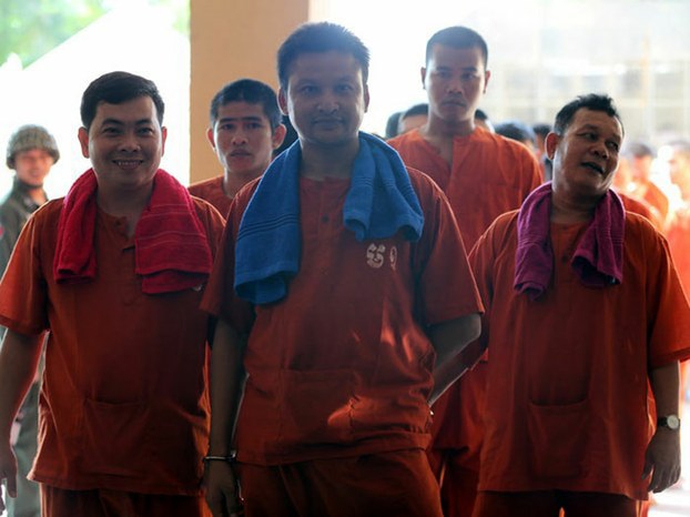 Chhay Sarith (L), Mao Hoeun (C) and Sot Vanny (R) are shown on their way to Phnom Penh Municipal Court, May 10, 2016.