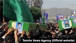 A funeral is held in the Iranian city of Mashhad for four Afghan refugees who were killed in action in Syria. (file photo)