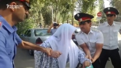 Mother Of Tajik Attack Suspect Pours Gasoline On Herself In Protest