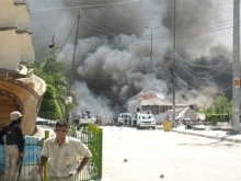 Iraq - Black smoke billows from the security headquarters of the Imam Hussein and Imam Abbas shrines in Karbala, 28Aug2007