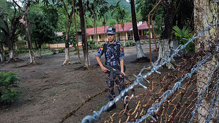 A border policeman stands guard at the Kyikanpyin border station's command center in Maungdaw township, western Myanmar's Rakhine state, July 14, 2017.